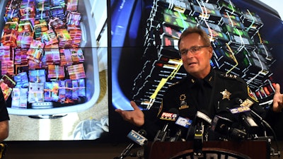 Kenosha County Sheriff David Beth talks about the THC-infused vaping cartridges that were part of a large-scale marijuana operation during a news conference in Kenosha Wednesday, Sept. 11, 2019.