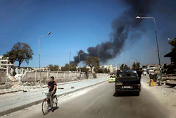 Smoke from government shelling in a residential area of Aleppo, Syria, Sept. 23, 2012.