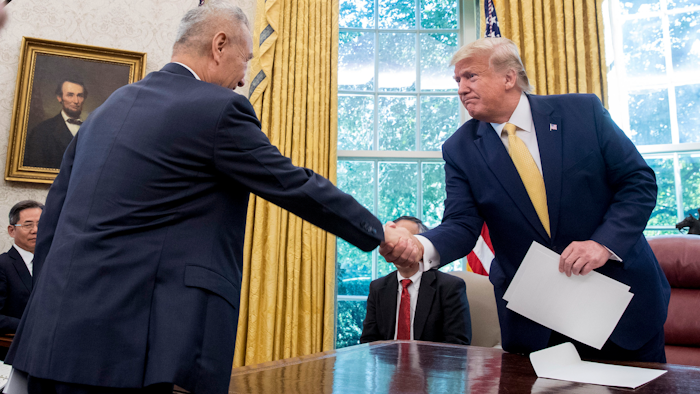 In this Oct. 11, 2019, file photo, President Donald Trump shakes hands with Chinese Vice Premier Liu He.