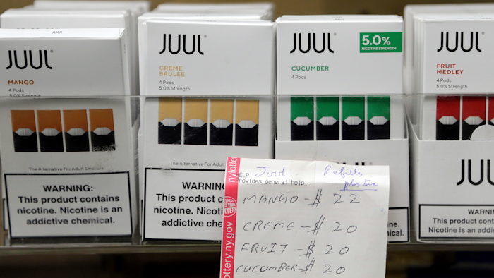 In this Dec. 20, 2018, file photo, Juul products displayed at a smoke shop in New York.