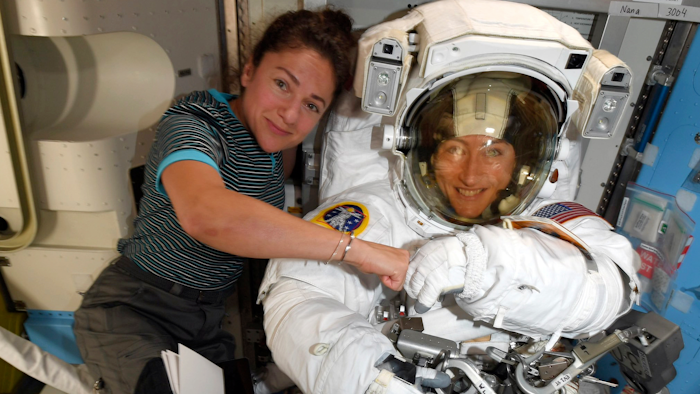 In this image released Friday, Oct. 4, 2019, by NASA, astronauts Christina Koch, right, and, Jessica Meir pose on the International Space Station. The first all-female spacewalk is back on, six months after a flap over spacesuits led to an embarrassing cancellation. NASA announced Friday that the two U.S. astronauts aboard the International Space Station will pair up for a spacewalk later this month.