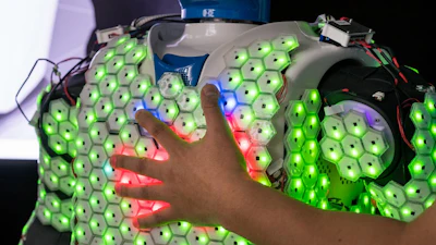 Each cell of this artificial skin developed by researchers at the Technical University of Munich (TUM) is equipped with a microprocessor and sensors to detect contact, acceleration, proximity and temperature. New control algorithms made it possible for the first time to apply artificial skin to a human-sized robot.