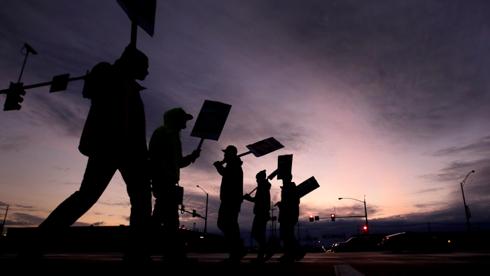 General Motors employees picket outside the Fairfax Assembly Plant in Kansas City, Kan. during the nationwide UAW strike against GM, Wednesday, Oct. 9, 2019.
