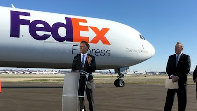 Tennessee Gov. Bill Haslam, left, talks about a newly $1 billion investment by FedEx Corp. at its hub in Memphis, March 14, 2018.