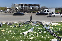 Debris is scattered across the street at the scene of an explosion at AB Specialty Silicones on Sunset Ave. and Northwestern Ave. on the border between Gurnee, Ill., and Waukegan.