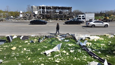 Debris is scattered across the street at the scene of an explosion at AB Specialty Silicones on Sunset Ave. and Northwestern Ave. on the border between Gurnee, Ill., and Waukegan.