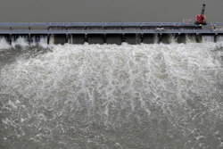 In this May 10, 2019, file photo, workers open bays of the Bonnet Carré Spillway in Norco, La.
