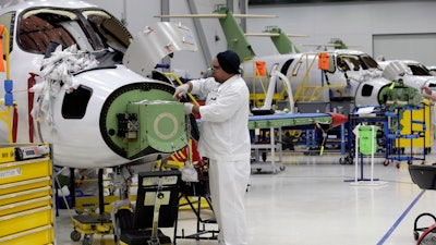 In this July 30, 2019, photo, an employee works on an aircraft in the production area at the Honda Aircraft Co. headquarters in Greensboro, N.C.