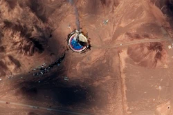 This satellite image from Maxar Technologies shows a fire at a rocket launch pad at the Imam Khomeini Space Center in Iran's Semnan province, Thursday, Aug. 29, 2019.