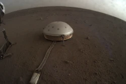 This April 25, 2019, photo made available by NASA shows the InSight lander's dome-covered seismometer, known as SEIS, on Mars.