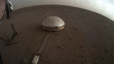 This April 25, 2019, photo made available by NASA shows the InSight lander's dome-covered seismometer, known as SEIS, on Mars.