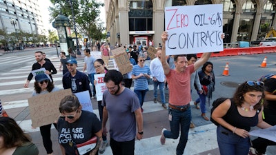 In this Sept. 20, 2019, file photo, Google employees make their way up Market Street to join others in a climate strike rally at City Hall in San Francisco.