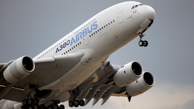 In this June 18, 2015, file photo, an Airbus A380 takes off for its demonstration flight at the Paris Air Show.