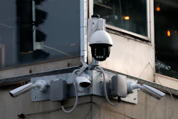 In this photo taken Sept. 25, 2019, high-tech video cameras hang from an office building in downtown Belgrade.