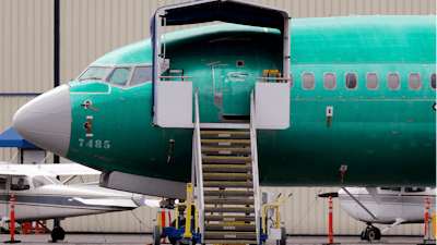 In this April 8, 2019, file photo, a Boeing 737 Max 7 jet adjacent to a Boeing Co. production facility in Renton, Wash.