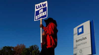 Yolanda Jacobs, a United Auto Workers member, walks the picket line at the General Motors Romulus Powertrain plant in Romulus, Mich., Oct. 9, 2019.