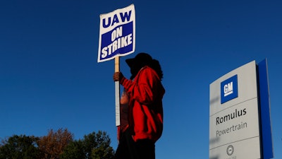 Yolanda Jacobs, a United Auto Workers member, walks the picket line at the General Motors Romulus Powertrain plant in Romulus, Mich., Wednesday, Oct. 9, 2019.