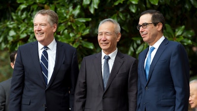 Chinese Vice Premier Liu He, center, U.S. Trade Representative Robert Lighthizer, left, and Treasury Secretary Steven Mnuchin before trade meetings in Washington, Oct. 10, 2019.