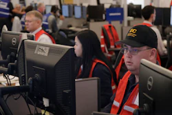 In this Oct. 10, 2019, file photo, Pacific Gas & Electric employees work in the PG&E Emergency Operations Center in San Francisco.