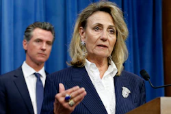 In this July 23, 2019, file photo, Marybel Batjer, of the California Public Utilities Commission, speaks during a news conference as Gov. Gavin Newsom looks on in Sacramento, Calif.