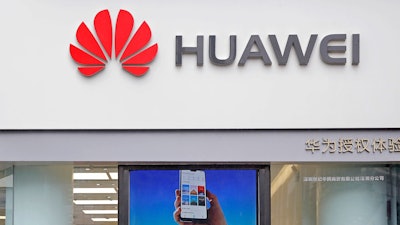 In this March 7, 2019, file photo, a logo of Huawei is displayed at a shop in Shenzhen, China.