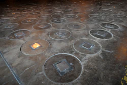 In this Nov. 20, 2013, file photo, radioactive waste, sealed in large stainless steel canisters, stored at the Savannah River Site near Aiken, S.C.