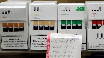 In this Dec. 20, 2018, file photo, Juul products displayed at a smoke shop in New York.