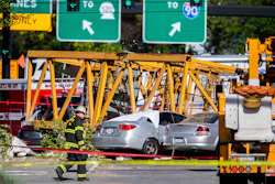 In this April 27, 2019, file photo, emergency crews work the scene of a construction crane collapse near near Interstate 5 in Seattle.