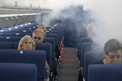FAA employees participate in a demonstration of an airline cabin filling with smoke in a simulator at the FAA Civil Aerospace Medical Institute in the Mike Monroney Aeronautical Center, Oklahoma City, Oct. 17, 2019.