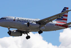 In this Oct. 18, 2019, photo, an American Airline plane flies in to Salt Lake City International Airport.