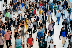 In this June 21, 2019, file photo, commuters walk through a corridor in the World Trade Center Transportation Hub in New York.