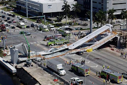 In this March 15, 2018, file photo, emergency personnel respond after a pedestrian bridge collapsed onto a highway at Florida International University in Miami.