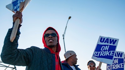 Motorline worker Ray Gladney of Florrisant, materials worker Brookes Robinson of Central West End, and Trim Doorline Worker Danielle Harris of Richmond Heights, picket at the General Motors plant in Wentzville, Mo., Oct. 22, 2019.