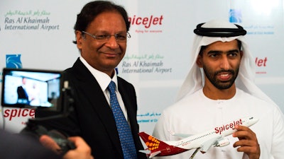 SpiceJet chairman and managing director Ajay Singh, left, and Sheikh Khalid bin Saud Al Qasimi pose for photographs during a news conference in Ras al-Khaimah, United Arab Emirates, Oct. 23, 2019.