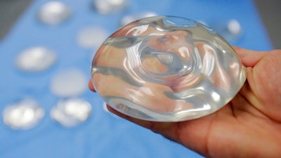 This Dec. 11, 2006, file photo shows a silicone gel breast implant in Irving, Texas.