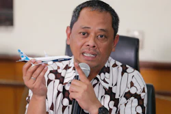 National Transportation Safety Committee investigator Nurcahyo Utomo holds a model of an airplane during a press conference in Jakarta, Oct. 25, 2019.