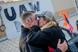 Clio resident Dawn Dekalita, a 16-year employee at the Flint Assembly Plant, plants a kiss on Shop Committee's Dustin Culhane in celebration as the United Auto Workers strike against General Motors comes to an emotional close outside of the Flint Assembly Plant, Oct. 25, 2019, in Flint, Mich.