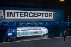 Young Dutch inventor Boyan Slat, right, unveils the Interceptor in Rotterdam, Netherlands, Saturday, Oct. 26, 2019. Slat is taking his effort to clean up floating plastic from the Pacific Ocean to rivers, using the Interceptor, a new floating device to catch garbage before it reaches the seas.