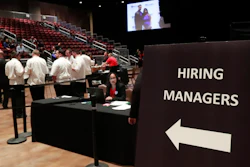 In this June 4, 2019, file photo, managers wait for job applicants at the Seminole Hard Rock Hotel & Casino Hollywood during a job fair in Hollywood, Fla.