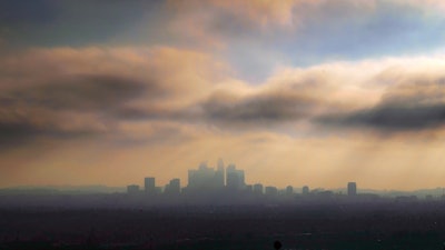 In this Oct. 26, 2018, file photo, downtown Los Angeles is shrouded in early morning coastal fog and smog.