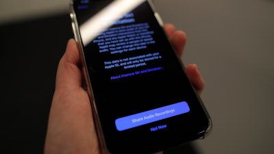 A screen displays a notice when installing the update, iOS 13.2 on an iPhone on Tuesday, Oct. 29, 2019, in New York.