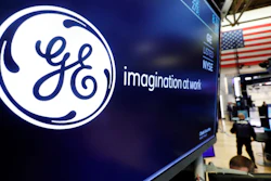 In this Aug. 16, 2019, file photo, the logo for General Electric appears above a trading post on the floor of the New York Stock Exchange.