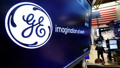 In this Aug. 16, 2019, file photo, the logo for General Electric appears above a trading post on the floor of the New York Stock Exchange.