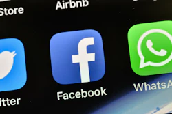 In this Nov. 15, 2018, file photo, the icons of Facebook and WhatsApp pictured on an iPhone in Gelsenkirchen, Germany.