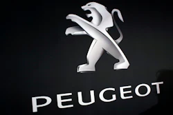 In this March 1, 2018 photo, the logo of Peugeot is displayed at PSA Peugeot Citroen headquarters during the presentation of the company's 2017 full year results, in Rueil-Malmaison, west of Paris, France. Italian-American carmaker Fiat Chrysler Automobiles on Wednesday, Oct. 30, 2019 confirmed that it is in talks with French rival PSA Peugeot, its second bid this year to reshape the global auto industry facing huge challenges with the transition to electric and autonomous vehicles.