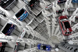 In this March 14, 2017, file photo, Volkswagen cars are lifted inside a delivery tower in Wolfsburg, Germany.