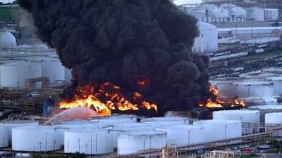 In this March 18, 2019, file photo, firefighters battle a petrochemical fire at the Intercontinental Terminals Company in Deer Park, Texas.