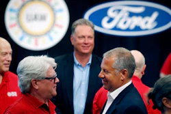 In this July 15, 2019, file photo, United Auto Workers Local 600 President Bernie Ricke, left, talks with Ford Motor Co. President-Automotive Joseph R. Hinrichs after opening contract talks in Dearborn, Mich.