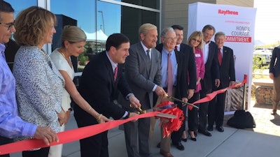 Arizona Gov. Doug Ducey and Dr. Taylor W. Lawrence, president of Raytheon's Missile Systems business, cut the ribbon at a new facility unveiling, May 2018.