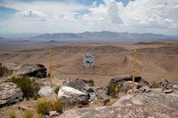In this July 14, 2018, file photo, a sign warns of a falling danger on the crest of Yucca Mountain.